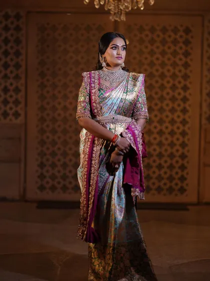 A regal portrait session for a client, featuring a stunning hand-embroidered blouse and a beautiful Kanjeevaram saree. The makeup was designed to give a royal, timeless feel.