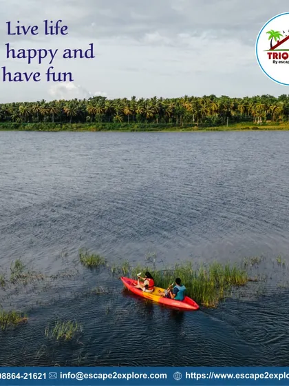 Live life, be happy, and have fun. An aerial shot of a couple kayaking in a quiet part of the lake.