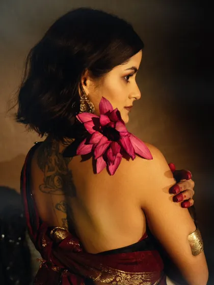 A beautiful and artistic portrait showing the back details, with a lotus flower adding a touch of color and symbolism.