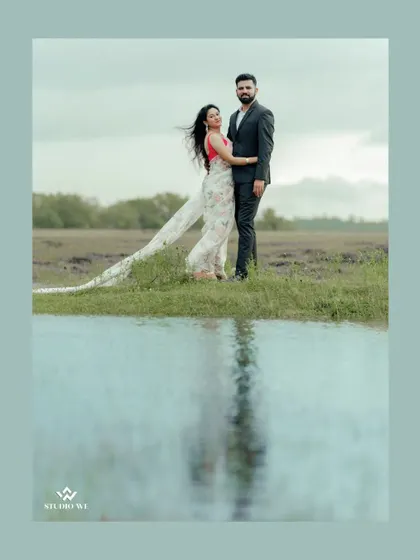 A beautiful reflection shot of a couple in a puddle. We are always looking for creative ways to frame our shots and tell a unique story.