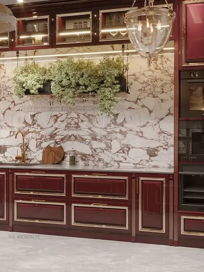 The main workstation in the maroon classical kitchen. We've included hanging planters above the sink to add a touch of fresh greenery to the warm, elegant space.