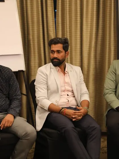 Our team members listening intently during the panel discussion. We are always eager to learn from and share with fellow industry experts.