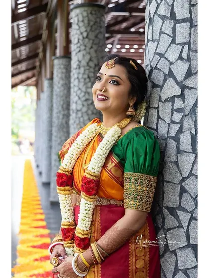 Ashwini looking gorgeous in her nine-yard saree for her wedding ceremony.
