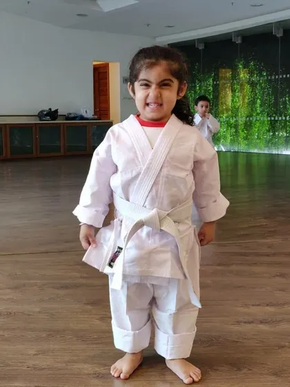 And here is that same little champion with a proud, happy grin after practice. Seeing this kind of confidence grow in a child is the best part of my job.