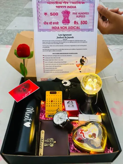 For a truly unique romantic gift, I offer this 'Love Agreement' hamper. It features a fun, personalized certificate on mock stamp paper, along with a custom watch, bottle, ring, and other romantic goodies for your partner.