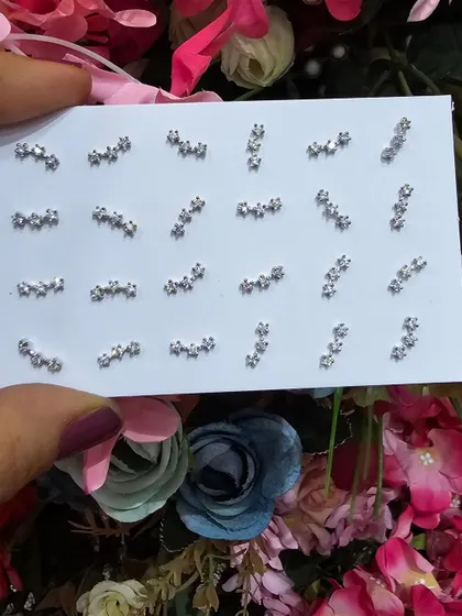 A collection of our curved bar and star cluster studs, perfect for creating a modern and celestial-themed ear stack.