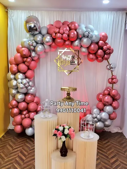 A chrome rose gold and silver balloon arch, another affordable option at my party hall.