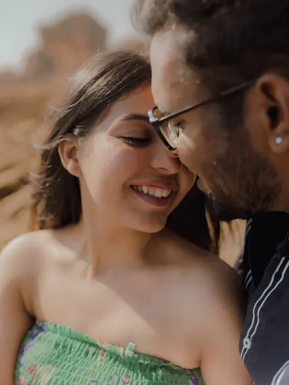 An intimate and tender close-up, capturing a quiet moment of connection and a gentle smile.