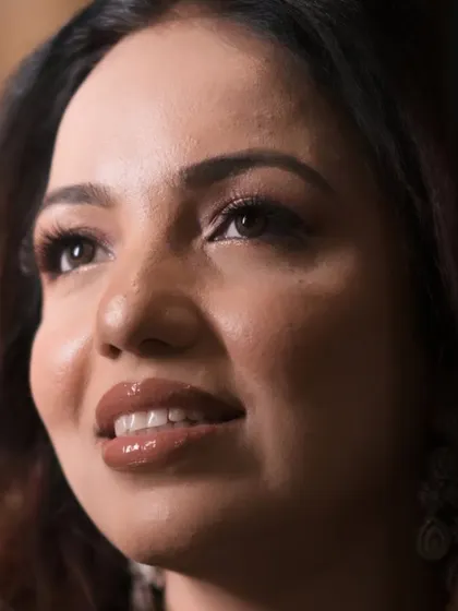 An artistic close-up capturing the glossy lips and glowing skin of this beautiful engagement makeup look.