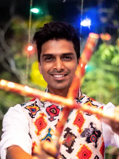 Getting ready for Dandiya season. A photo of me with dandiya sticks, excited to announce the upcoming festive gigs.
