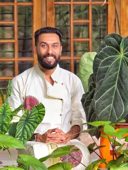 A portrait amidst the lush greenery of my favorite foliage plants. The variety of leaf shapes and patterns is incredible.