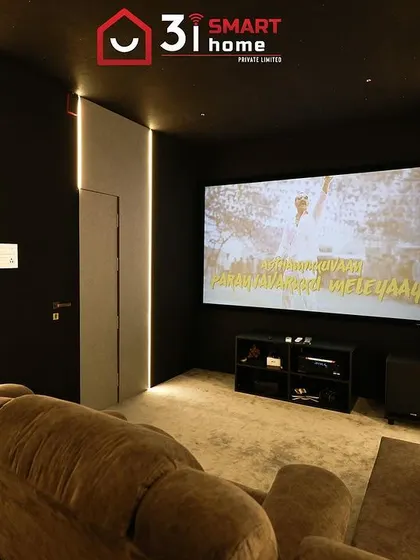 The view from the recliner shows the large screen and the clean, minimalist design of the room, with simple LED strip lighting.