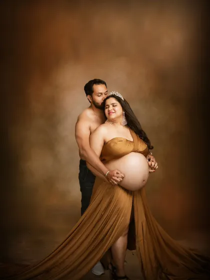 Golden moments of love and anticipation, where two hearts beat as one, dreaming of the little one who will soon complete their world.