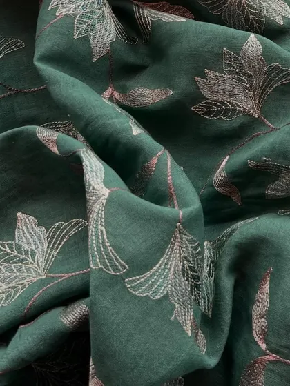A deep green embroidered linen with delicate floral vine embroidery, perfect for those days when you want to look chic yet feel effortless.