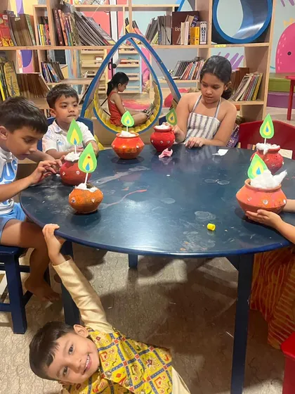 The kids decorating their own matkas for Janmashtami. This activity is always a hit, combining painting with learning about Lord Krishna's love for butter.
