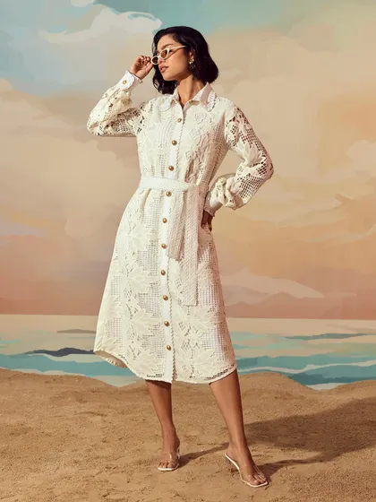 A full-length shot for Qala Clothing's "Casa Solana" collection. The painted backdrop and sand floor were part of a custom set we created to evoke a serene, seaside atmosphere for their resort wear line.