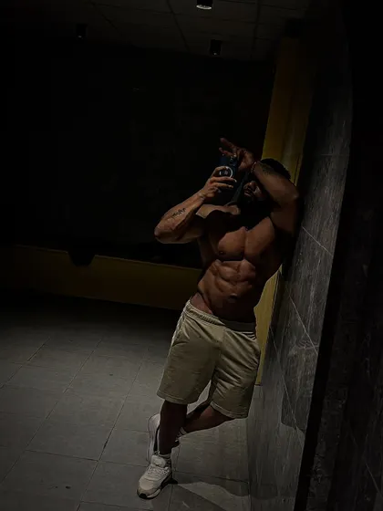 An ab shot in low light, which can make the muscles pop.