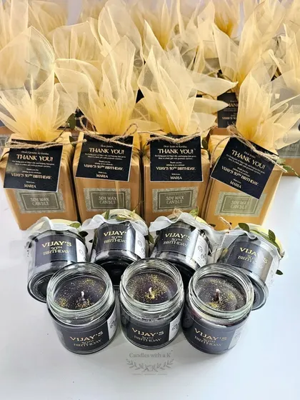 The complete set of 50th birthday favors, showing the candles and their beautiful packaging.