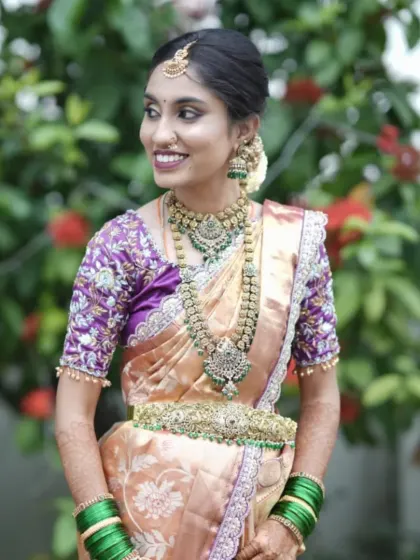 This bride looks absolutely regal in a Victorian-style antique jewellery set with green stone accents. The layered necklaces and matching waist belt create a cohesive and grand look for her wedding day.
