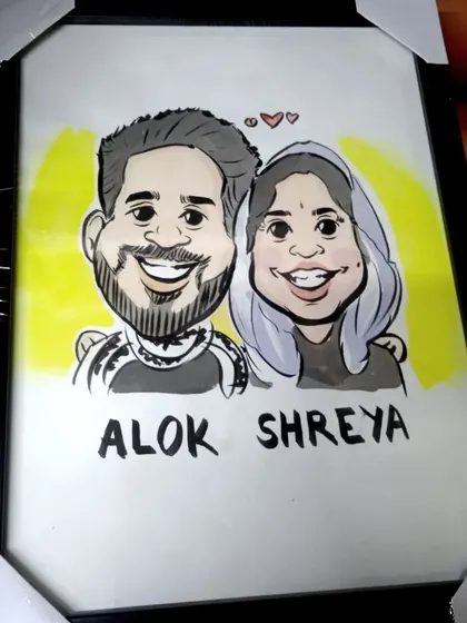 A framed caricature of a young couple, showcasing a simple yet expressive style. These custom portraits are shipped worldwide.