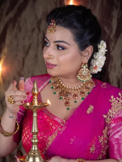 A festive Diwali look. This close-up shows the warm, smokey eye makeup and the traditional jewellery, perfect for celebrating the festival of lights.