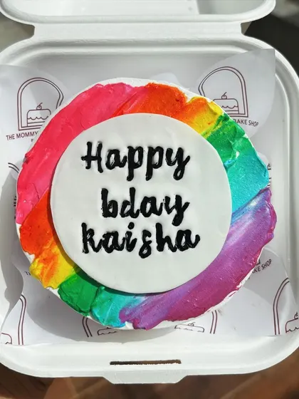 A vibrant rainbow bento cake. I love the texture created by painting the colors directly onto the buttercream.