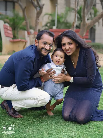 Such a happy family of three! This outdoor portrait captures a beautiful, candid moment of laughter and love between the parents and their little boy.