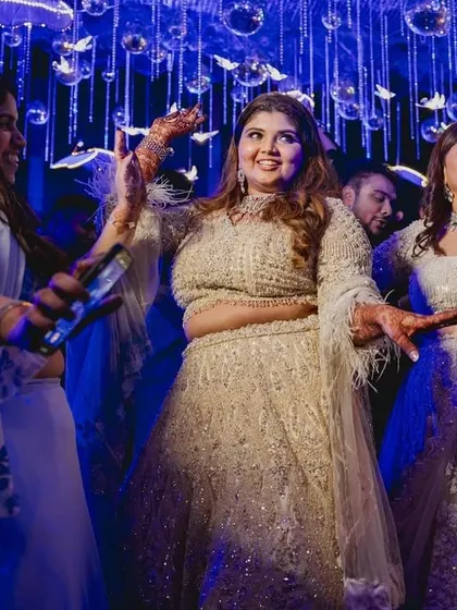 Dance like it's your wedding, because it is. The bride surrounded by her family on the dance floor.