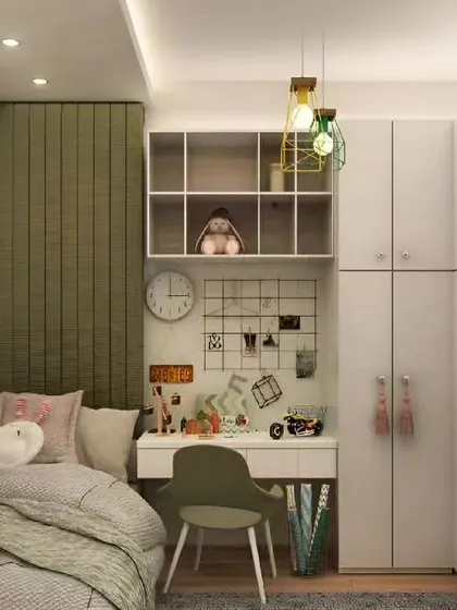 A compact and cozy bedroom perfect for a child or teen. The design includes a bed with a plush green headboard, a small desk with a grid for notes, and a full-sized wardrobe for ample storage.