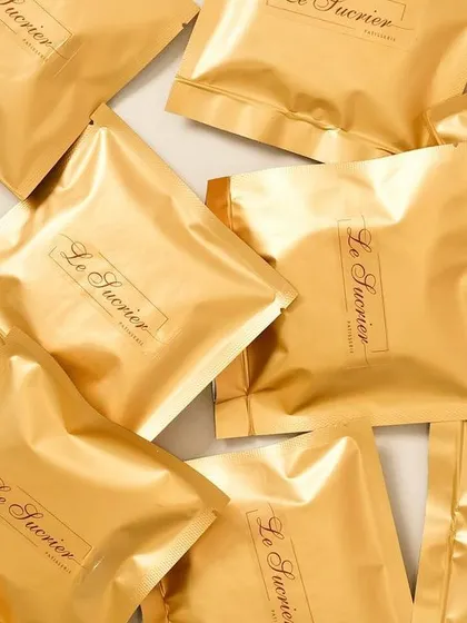 For corporate gifting, presentation and freshness are key. I individually pack my cookies in these elegant gold pouches to maintain their quality and provide a premium unboxing experience for every recipient.