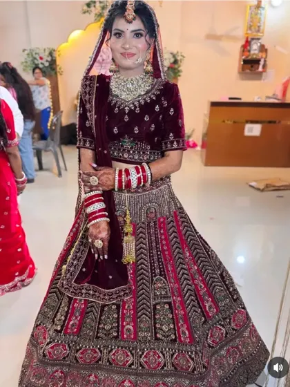 A stunning bride in her full wedding attire. Her intricate mehndi is a beautiful accessory that completes her regal look.
