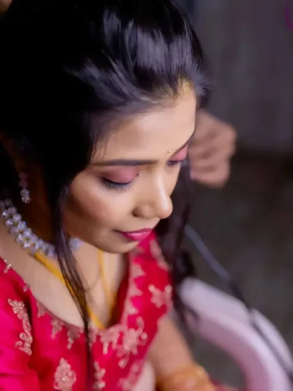 A close-up of the reception eye makeup, showing the blend of pink and shimmer for a glamorous effect.