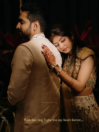"With this ring, I give you my heart forever." A deeply romantic portrait of the bride resting her head on her groom's shoulder, a picture of trust and love.