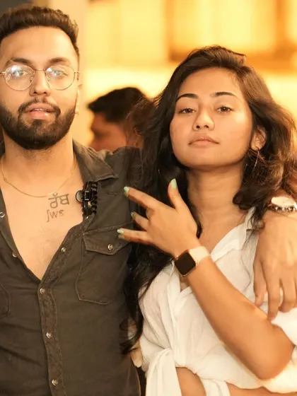 A cool couple posing for a photo, representing the young and trendy crowd at Pangeo.