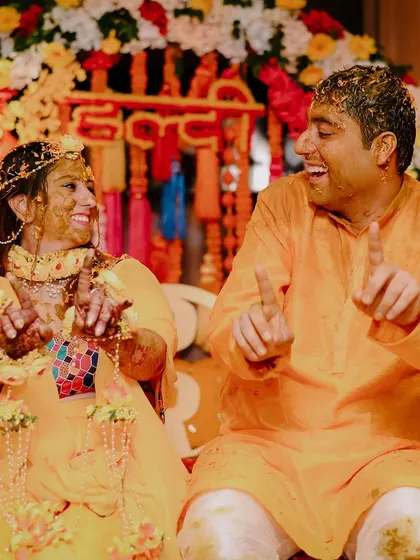 A playful moment between Pragya and Raghav during their haldi ceremony.