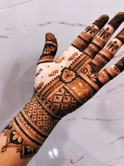 A close-up of the geometric half of the mismatched set, showing the checkerboard pattern and cuff.