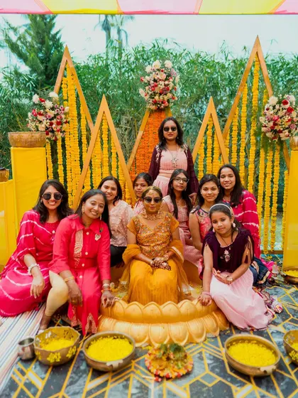 Another joyful group photo in front of our custom Haldi stage, capturing the love and laughter of the celebration.
