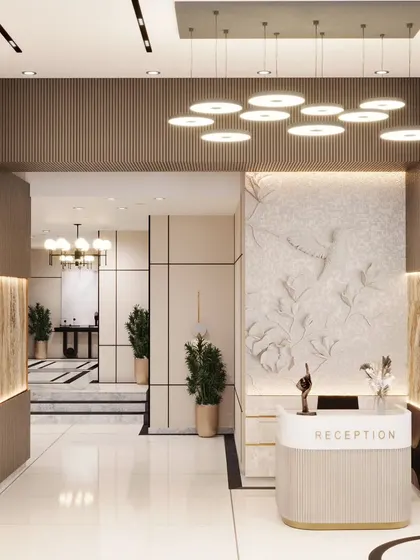 A successful reception area balances style and function. Here, we combined a textured feature wall, elegant lighting, and a clean, minimalist desk to create a space that is both welcoming to visitors and efficient for staff.