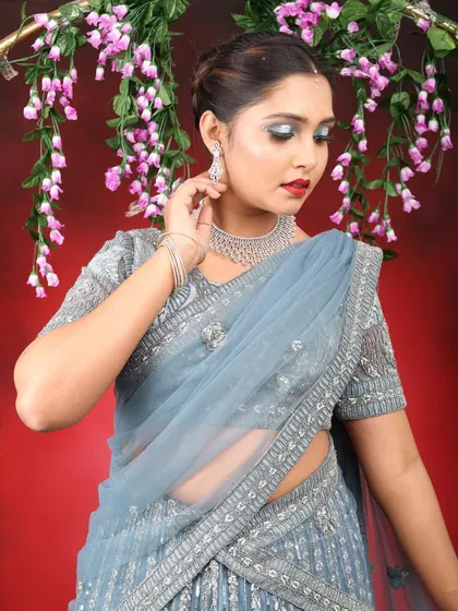 A final look at the glamorous reception-style makeup. The silver glitter on the eyes catches the light beautifully.