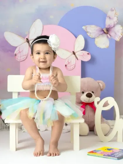 A magical unicorn and butterfly theme for a first birthday. The pastel colors, whimsical props, and dreamy backdrop create a true fairy tale setting.