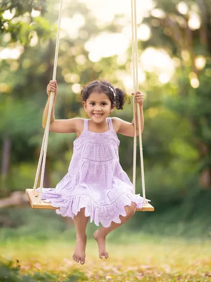There is a simple magic to a child on a swing. We brought this prop to our outdoor session to capture this little girl's pure joy and carefree spirit against a beautifully blurred natural backdrop.