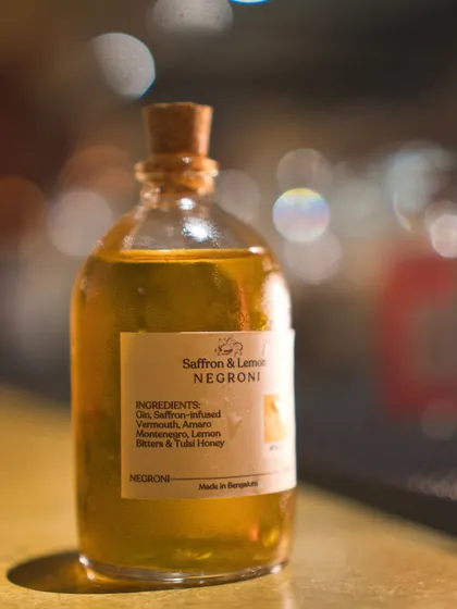 The Saffron & Lemon Negroni from our Negroni Week collection. The vibrant yellow hue and unique ingredients like Tulsi honey highlight our experimental and colorful approach to this classic drink.