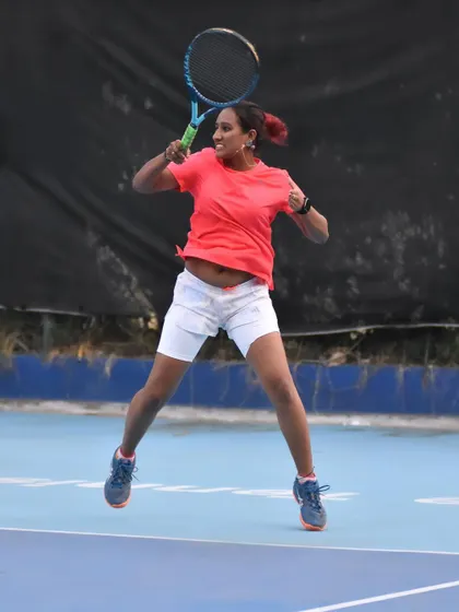 A full-body action shot capturing the intensity of a tournament match. My coaching emphasizes building the stamina and strength to play every point with maximum effort.