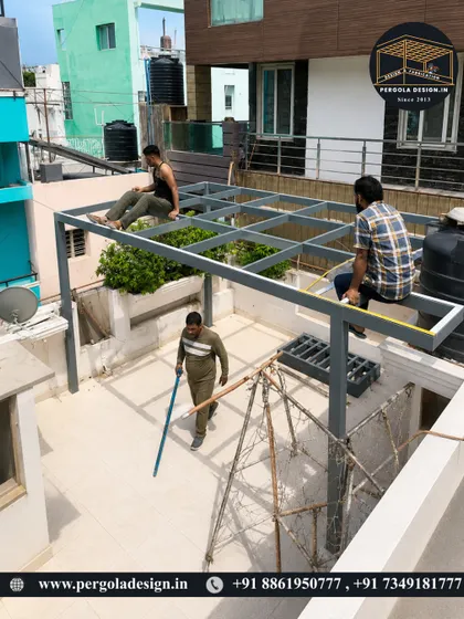 The installation process continues. Our fabricators are seen here ensuring every part of the steel frame is perfectly aligned and secured before the glass panels are fitted.