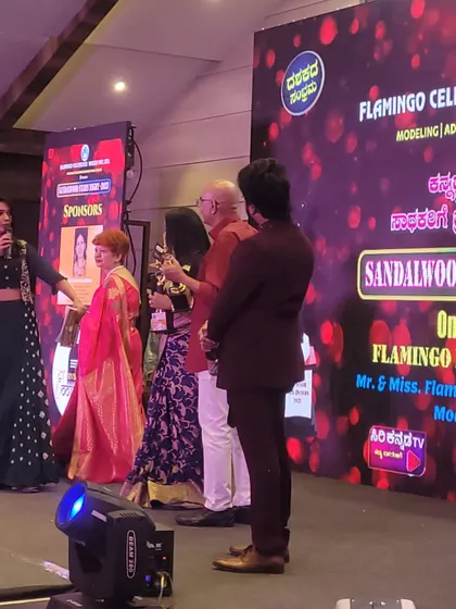 An awards presentation moment captured during the "ದಶಕದ ಸಂಭ್ರಮ" (Decade Celebration) event.