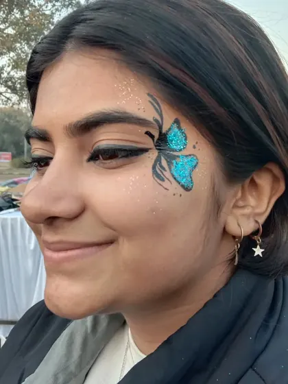 A simple and sweet blue glitter butterfly. It's a quick design that adds a lot of personality and fun.