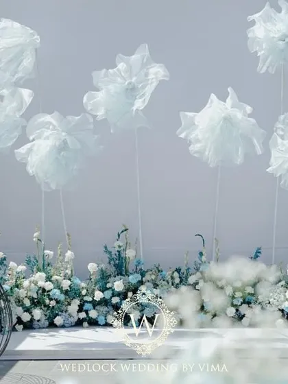 We created a dreamy photo-op for a poolside brunch with these life-sized, cloud-like florals. The whimsical structures against the clear sky provided a perfect, ethereal backdrop for pictures.