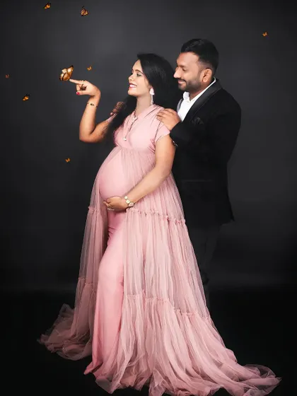 A touch of magic with fluttering butterflies. This creative edit adds a whimsical and dreamy quality to this beautiful couple's maternity portrait.