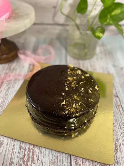 Celebrate Dad with a cake that's just for him. This Father's Day cake features a fun tic-tac-toe design, showing him he's a winner. Whether it's a simple mango cake or a rich chocolate one, it's a sweet way to show you care.