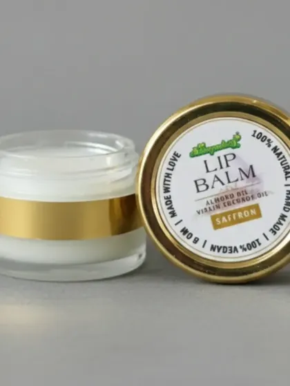 Another look at our Saffron Lip Balm. The clear glass jar shows the pure, creamy texture of the balm. It's designed to provide deep moisturization and protection.